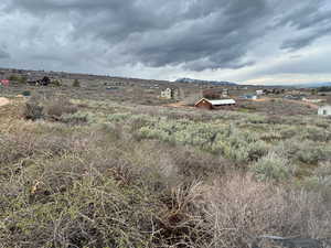 View of yard with a rural view