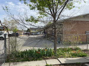 Exterior space with fence and brick siding