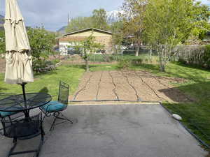 View of patio featuring fence and outdoor dining area