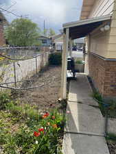 View of yard featuring fence