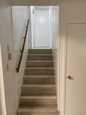 Staircase with wood finished floors