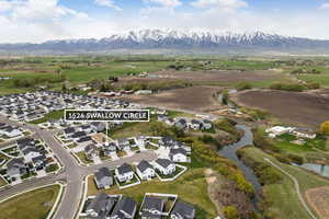 Aerial view featuring a residential view and a water and mountain view