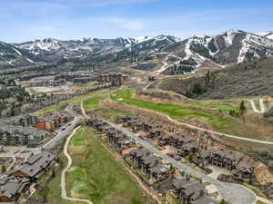 Drone / aerial view with a mountain view and view of golf course