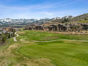View of property's community with a mountain view, a residential view, and view of golf course