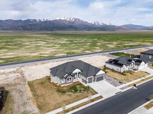 Drone / aerial view featuring a mountain view and a rural view