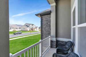 Balcony featuring a porch and a residential view