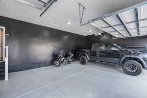 Garage featuring a garage door opener