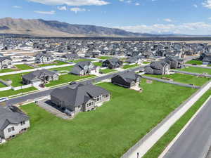 Birds eye view of property with a mountain view and a residential view
