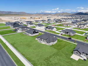 Drone / aerial view featuring a mountain view and a residential view