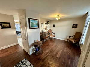 Living area featuring wood finished floors and baseboards