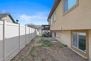 View of yard featuring fence