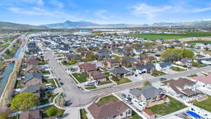 Aerial view featuring a water and mountain view and a residential view