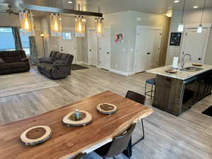 Interior space featuring recessed lighting, baseboards, a ceiling fan, and light wood-type flooring