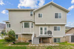 Rear view of house with a wooden deck
