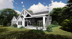 Back of property with a lawn, board and batten siding, and entry steps