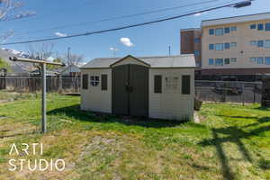 View of shed featuring a fenced backyard and a mountain view