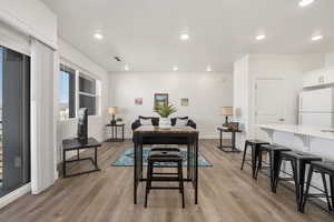 Dining area featuring visible vents, recessed lighting, light wood finished floors, and baseboards