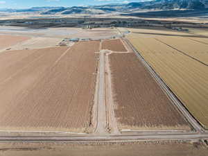 Birds eye view of property featuring a mountain view and a rural view