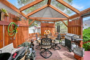 Exterior space featuring a skylight and beamed ceiling