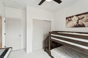 Bedroom featuring a closet, carpet flooring, and ceiling fan