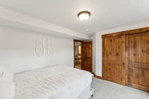 Bedroom with carpet and baseboards