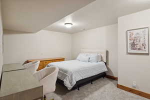 Bedroom with carpet flooring and baseboards