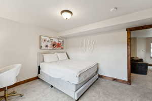 Bedroom with carpet and baseboards