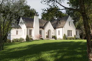 View of front facade with a high end roof, a chimney, and a front yard