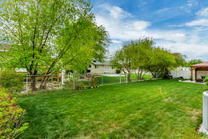 View of yard featuring a gazebo and a fenced backyard