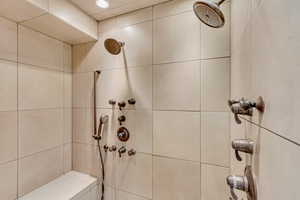 Full bath featuring tiled shower