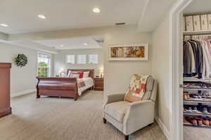 Bedroom featuring recessed lighting, visible vents, light carpet, and baseboards