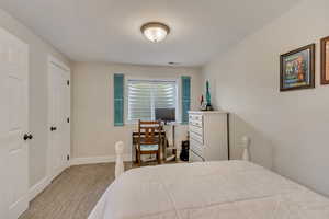 Bedroom with visible vents and baseboards