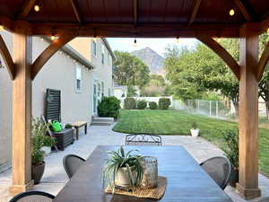 View of patio / terrace with a gazebo, a mountain view, and a fenced backyard