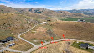 Aerial view of property and surrounding area with rural landscape and mountains