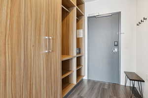 Spacious closet with wood finished floors