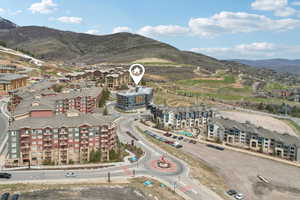 Birds eye view of property with a mountain view