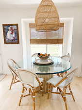 Dining area featuring light wood finished floors and baseboards