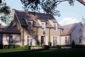 French country home with a chimney, a high end roof, a front yard, and stone siding