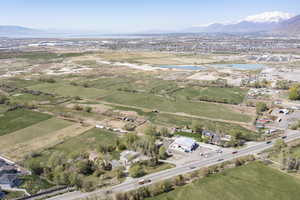 Drone / aerial view featuring a water and mountain view