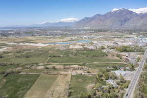 Birds eye view of property featuring a water and mountain view