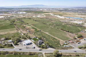Drone / aerial view featuring a water and mountain view