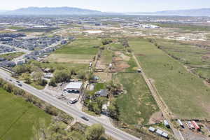 Birds eye view of property with a rural view and a mountain view