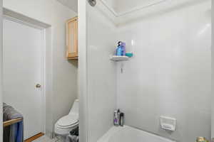 Bathroom with toilet and  shower combination