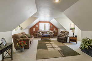 Bonus room with vaulted ceiling and carpet floors