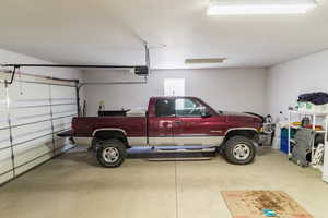 Garage featuring a garage door opener