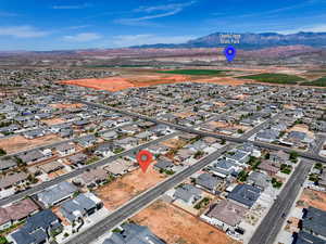 Aerial view featuring a mountain view and a residential view