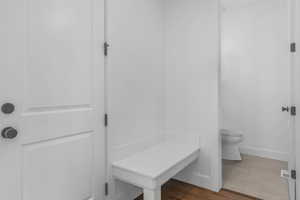 Bathroom with toilet and baseboards