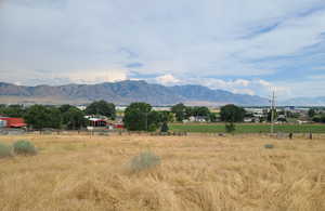 Property view of mountains with a rural view