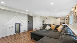 Living area featuring visible vents, recessed lighting, baseboards, and light wood-style floors