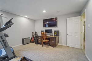 Office area featuring recessed lighting, carpet flooring, and baseboards